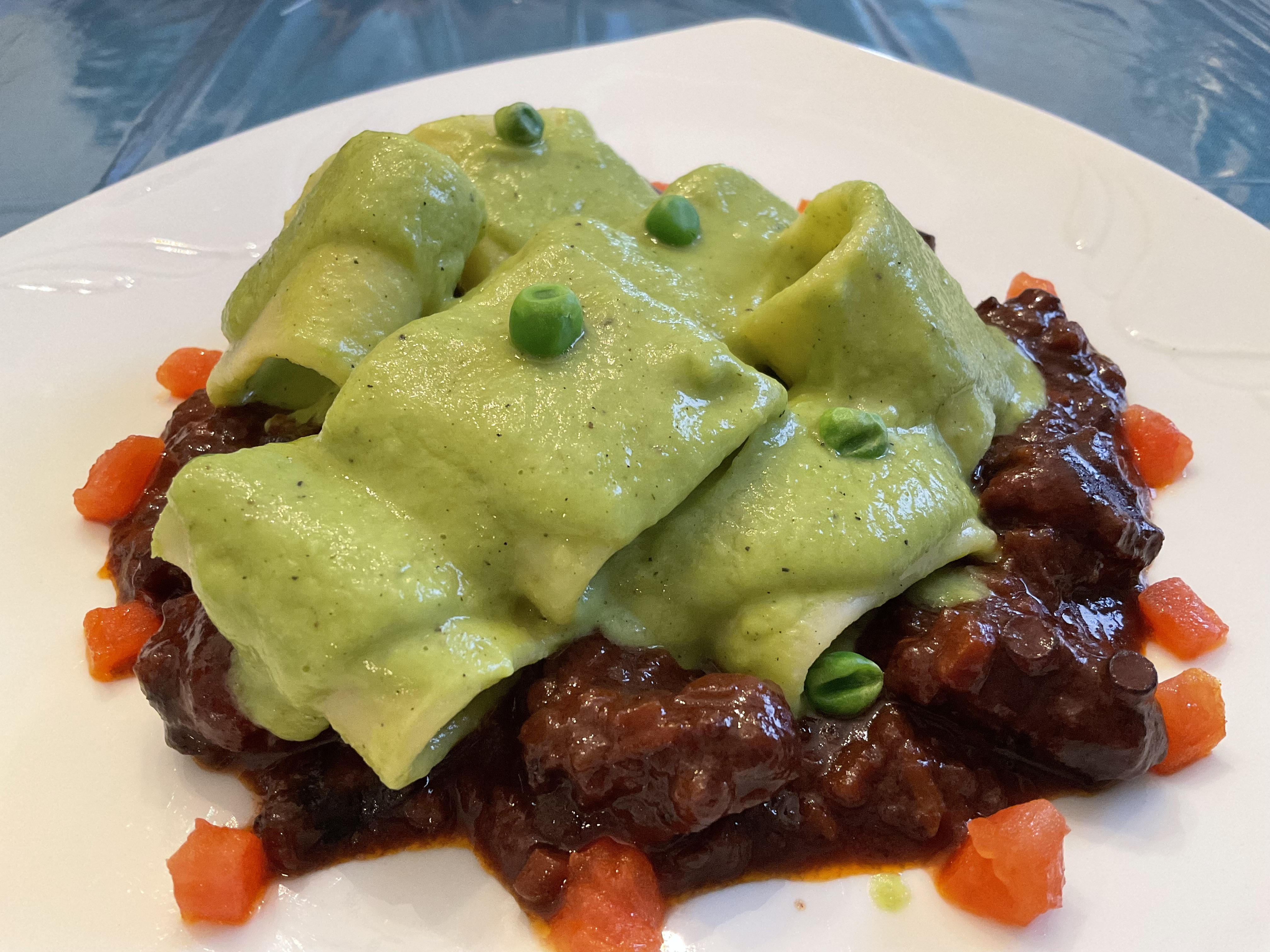 Mezzi paccheri with green pea coulis and octopus ragout