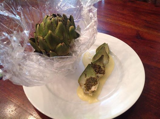 Fresh artichokes prepared for steaming in Carta Fata