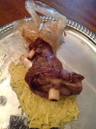 Lamb shank prepared for roasting in Carta Fata